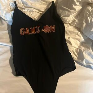 Pink bodysuit tags still attached